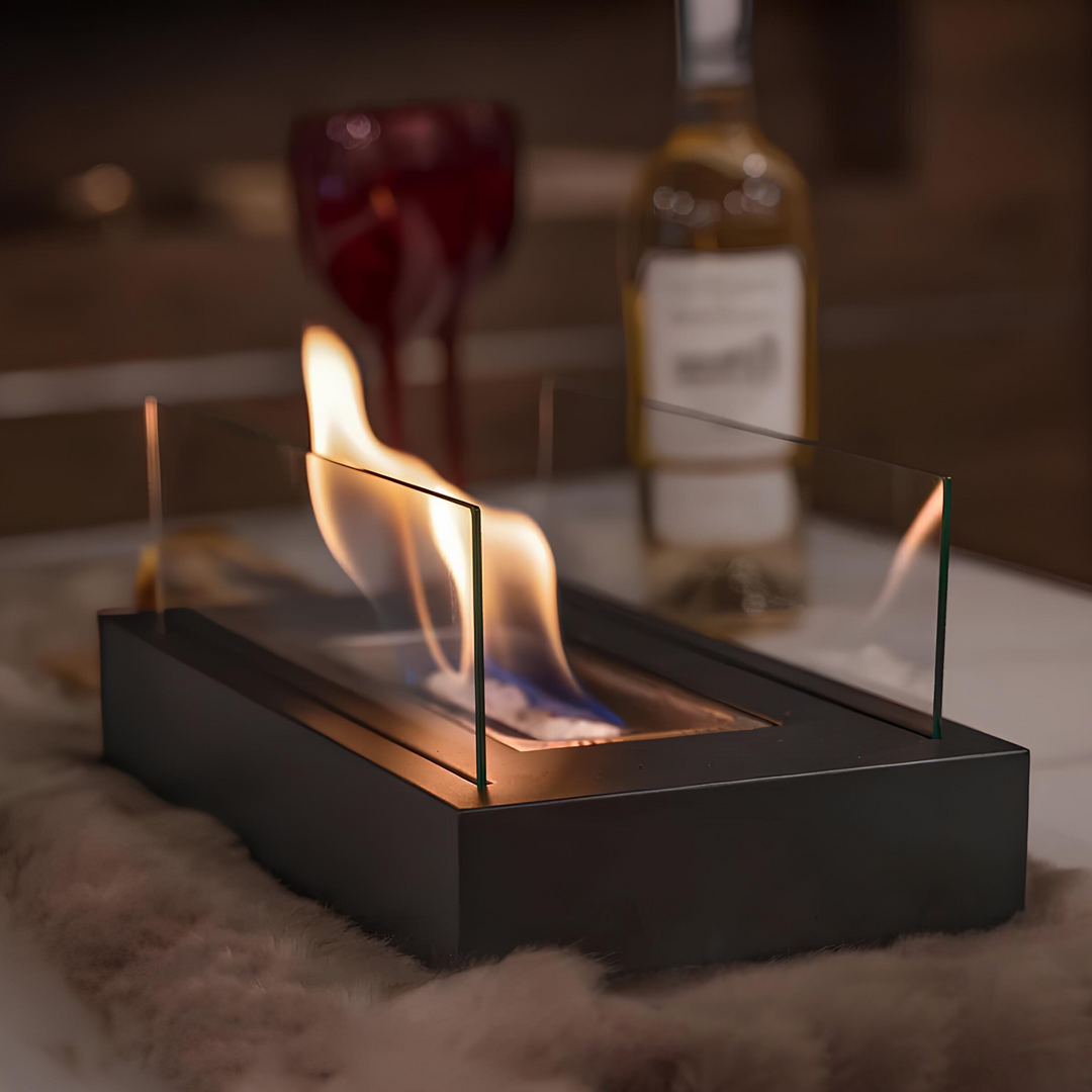 Black FireGlow tabletop bio-ethanol fireplace creating a cozy flame indoors
