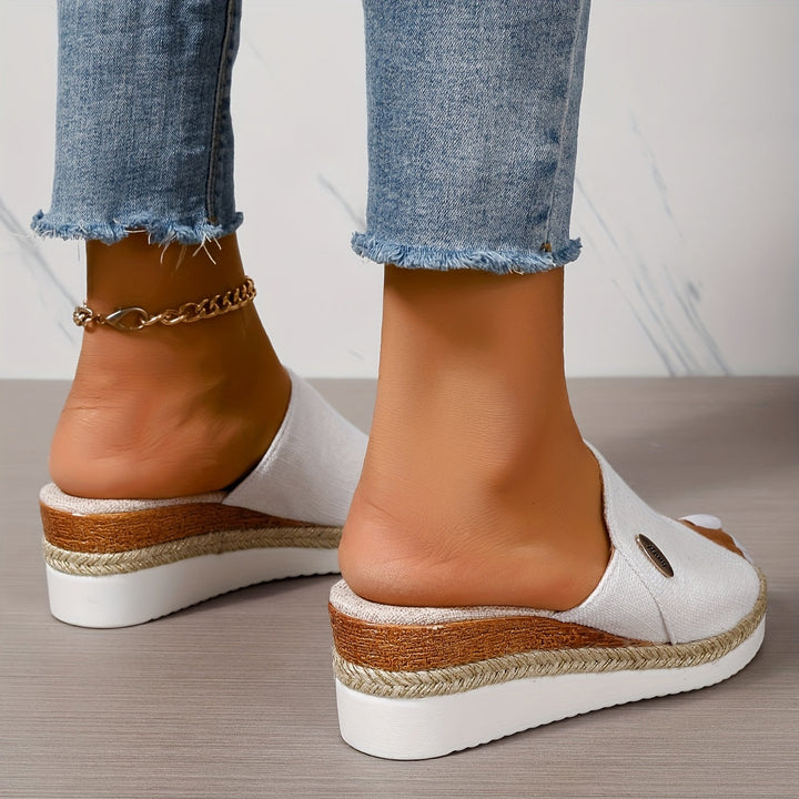 Top down view of women's slip-on summer sandals and footbed