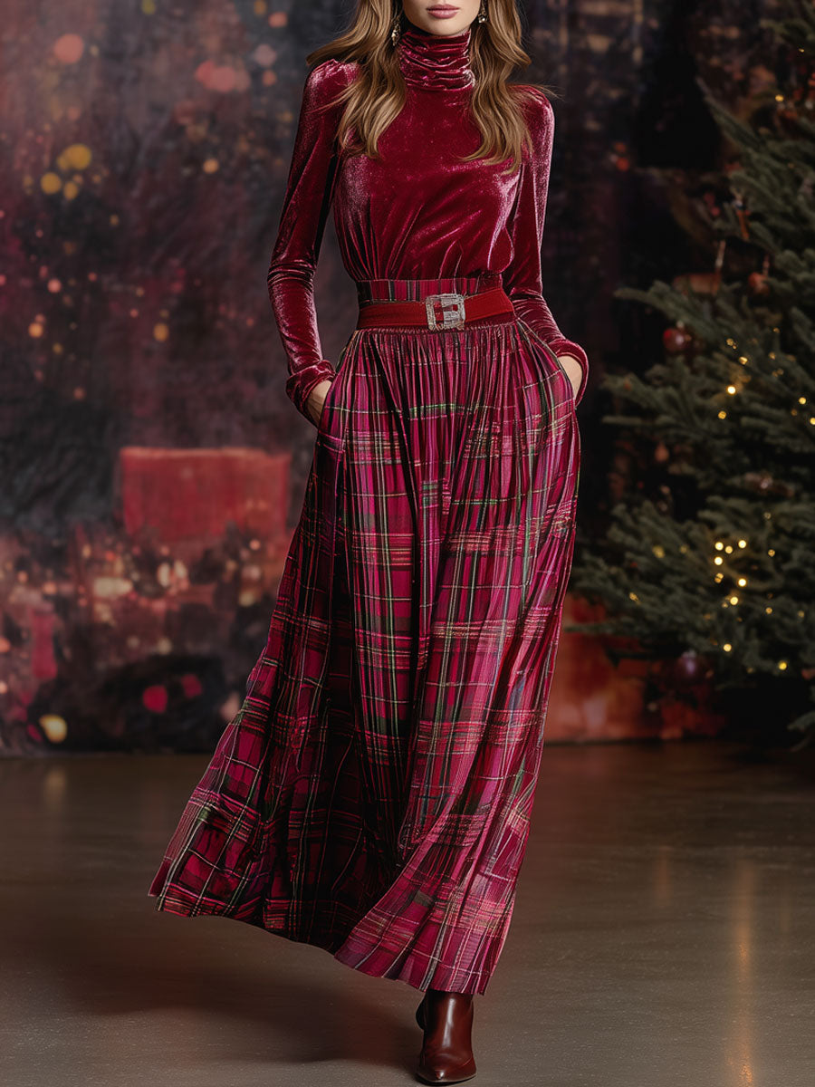 Model wearing a festive red velvet turtleneck and plaid skirt set standing near a decorated tree