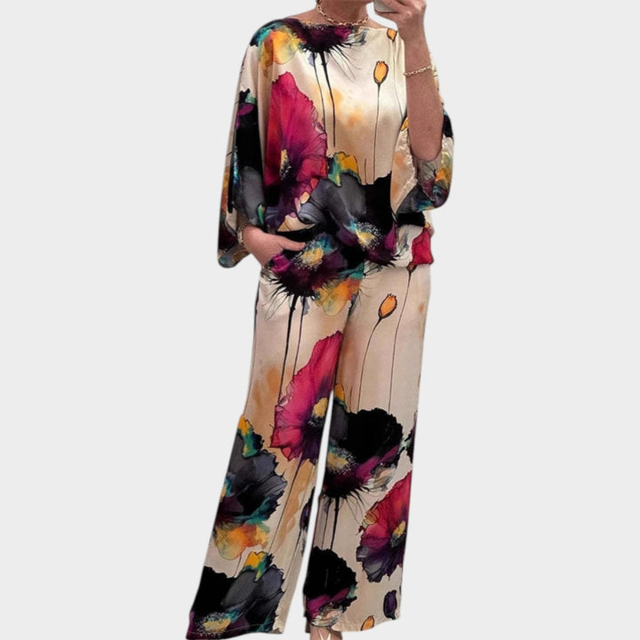 Womens fashion floral matching set with relaxed fit trousers and coordinated top.