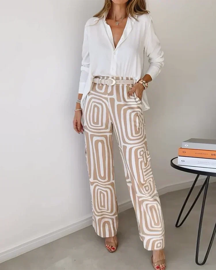 Woman wearing khaki patterned two-piece set with white blouse and patterned trousers