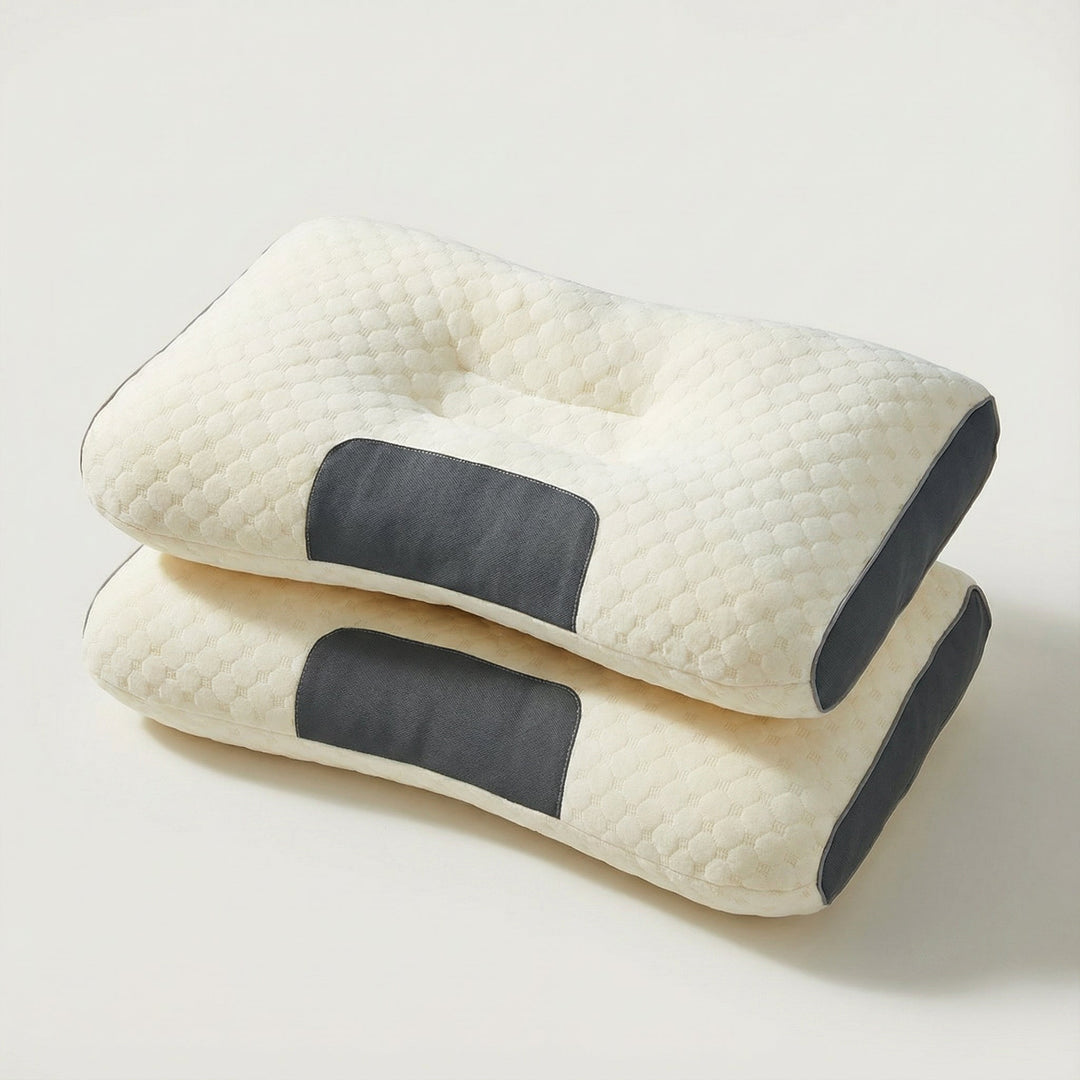 Two ergonomic orthopaedic neck pillows stacked together in White Grey and Cream Grey