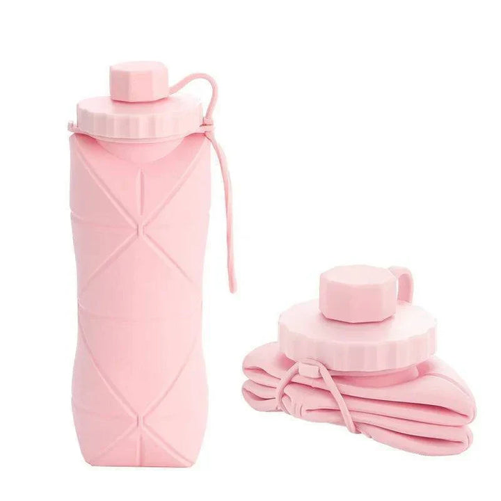 Pink 600ml collapsible silicone water bottle shown fully expanded and folded flat
