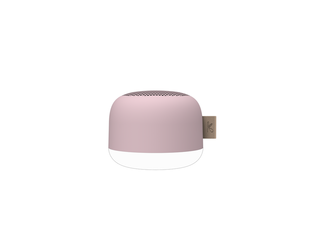 Hand holding the compact waterproof Bluetooth speaker for size reference