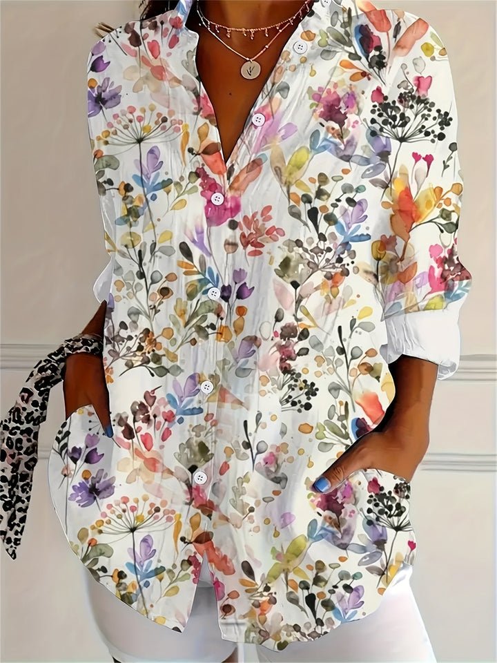 Women wearing a floral long sleeve button-down shirt with front pockets