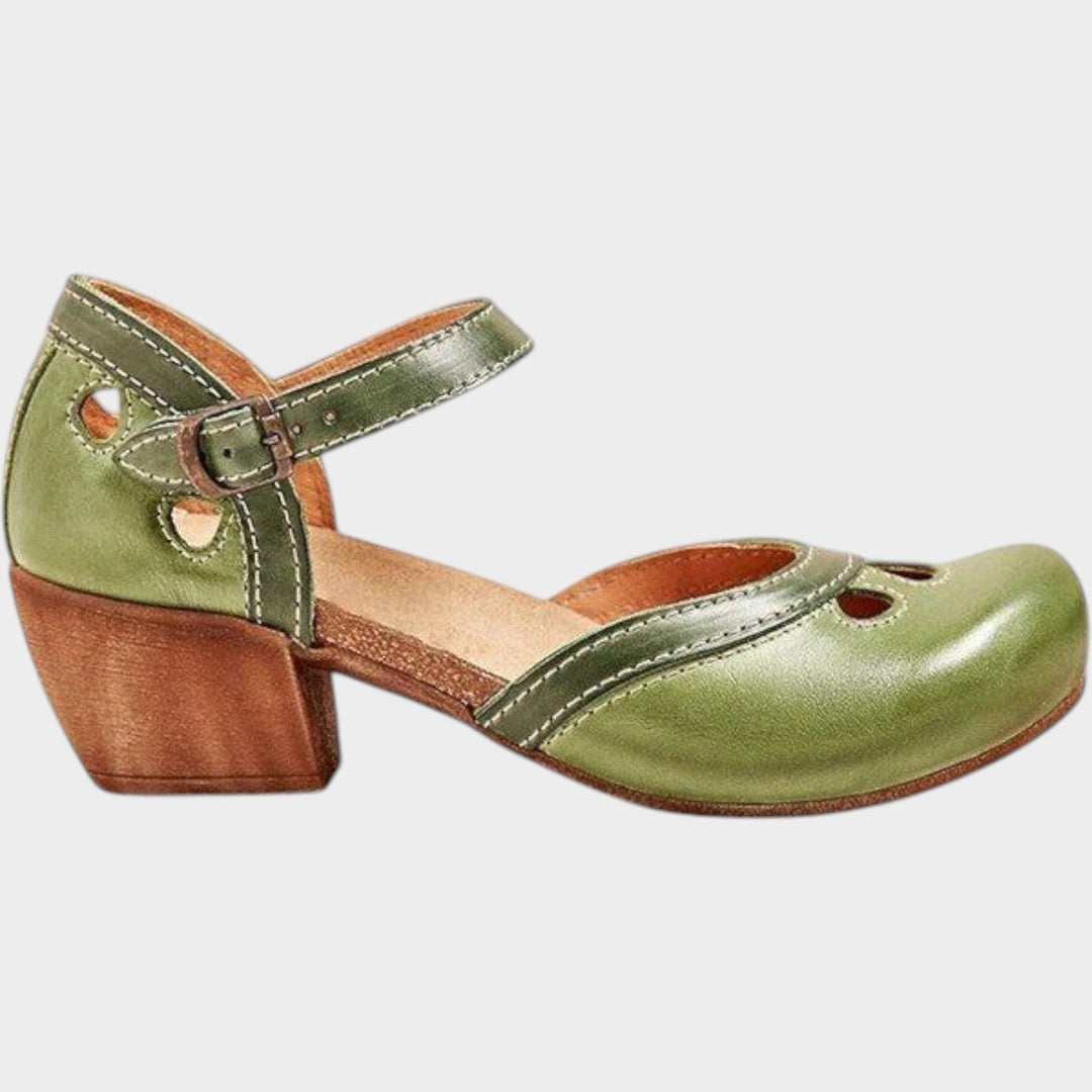 Close-up of the retro buckle closure and adjustable ankle strap on women's sandals