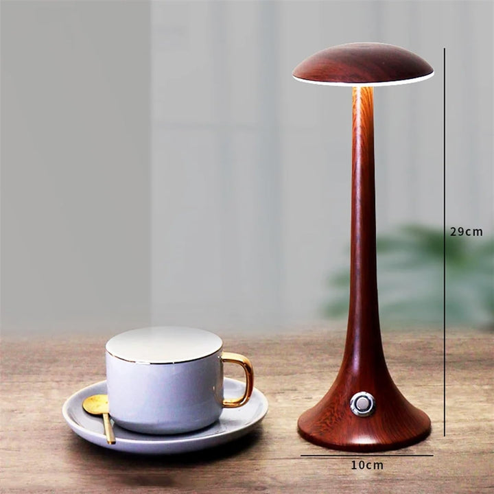 Cordless led mushroom lamp illuminated in a dark room to show ambient light effect