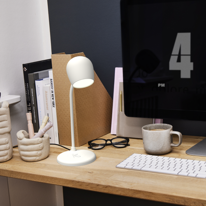Close-up of the wireless smartphone charging pad on the LED desk lamp base