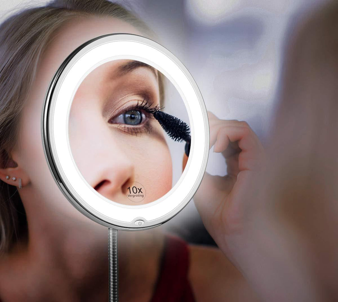 Woman applying makeup using a 10X LED magnifying mirror