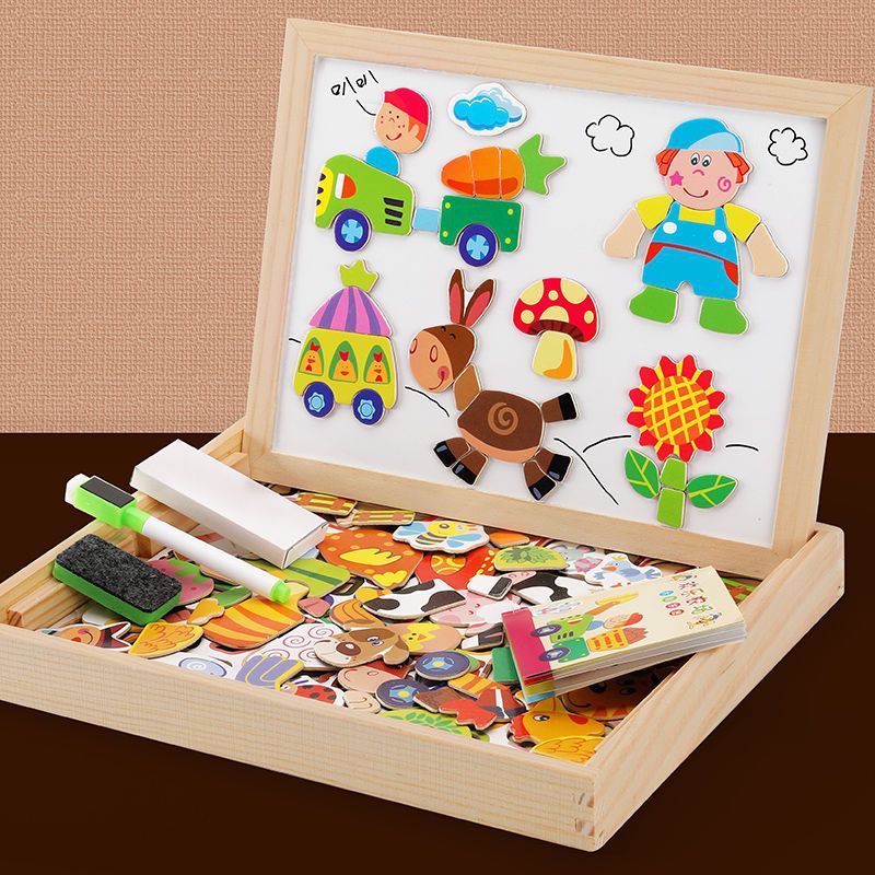 Child playing with kids 2-in-1 wooden magnetic drawing board and educational toy