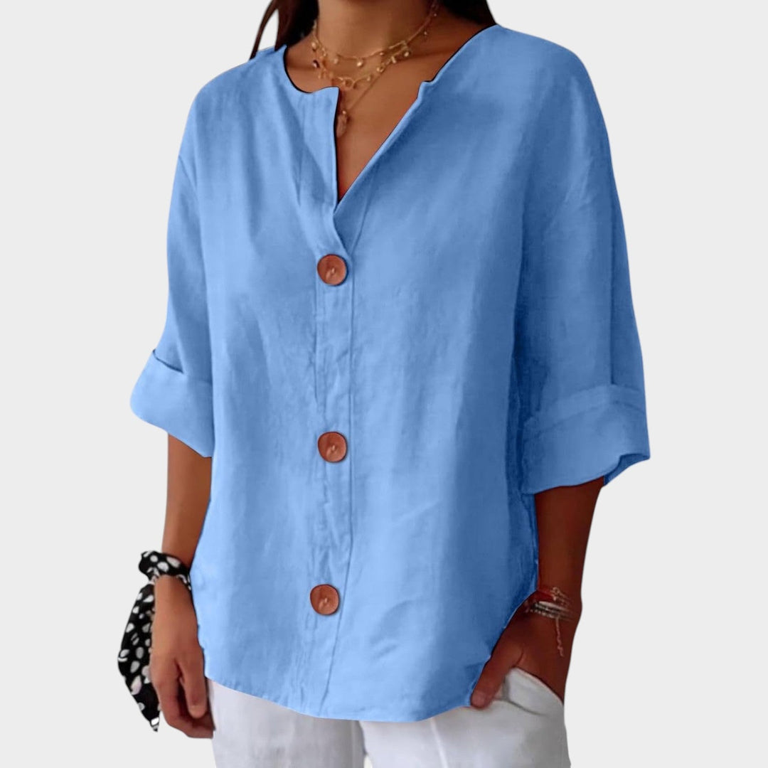 Versatile womens casual top featuring 3/4 sleeves and button up front design
