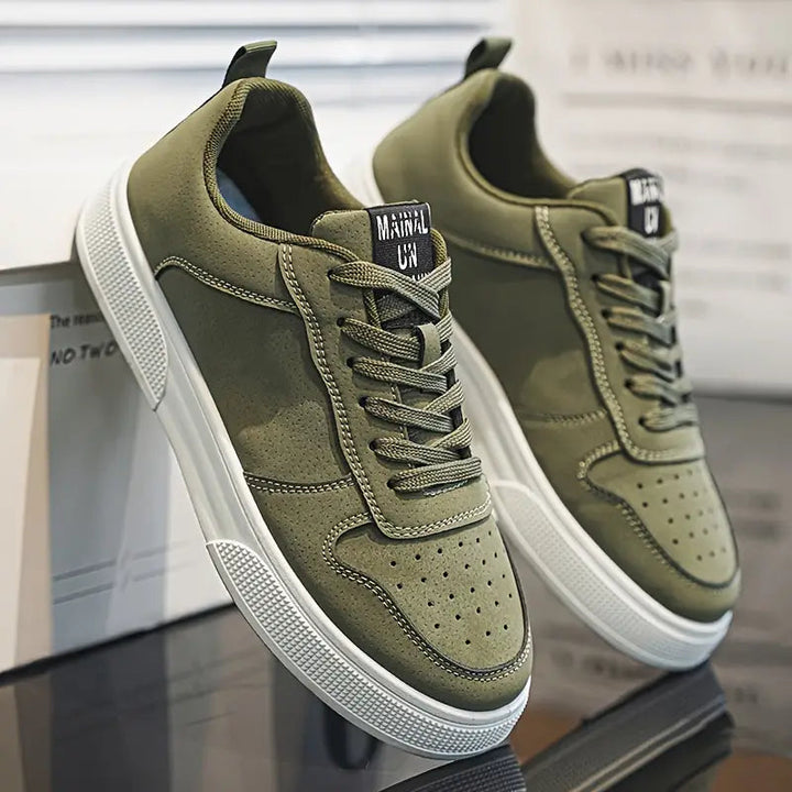 Side angle view of green men's walking sneakers