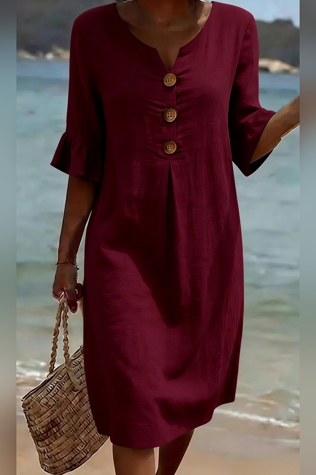 Detailed shot of V-neckline on the women's button dress