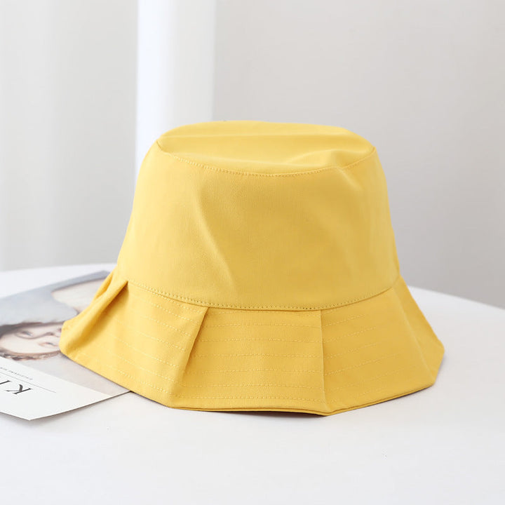 Yellow summer bucket hat on display