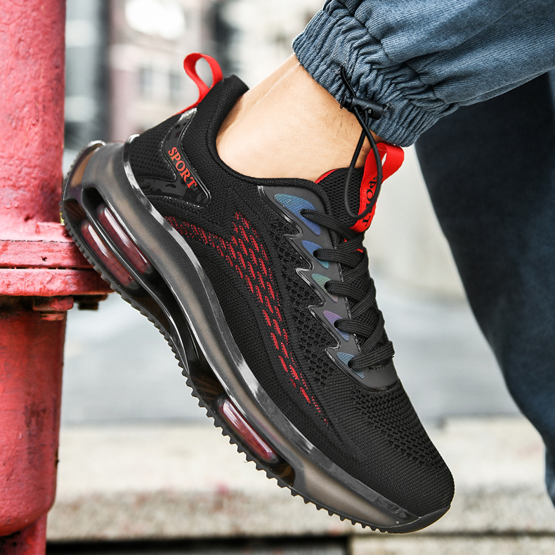 Close-up of black men's air cushion athletic trainer showing textured upper and translucent sole