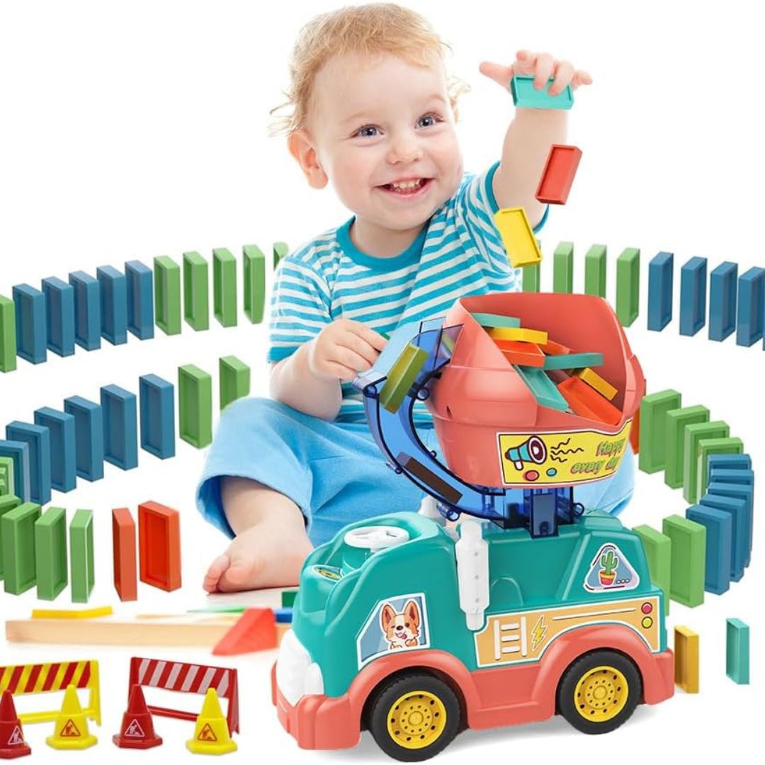 Toddler smiling while playing with the automatic domino truck toy