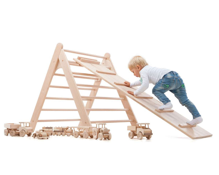 Wooden slide board attachment hooked securely to the climbing ladder for toddlers