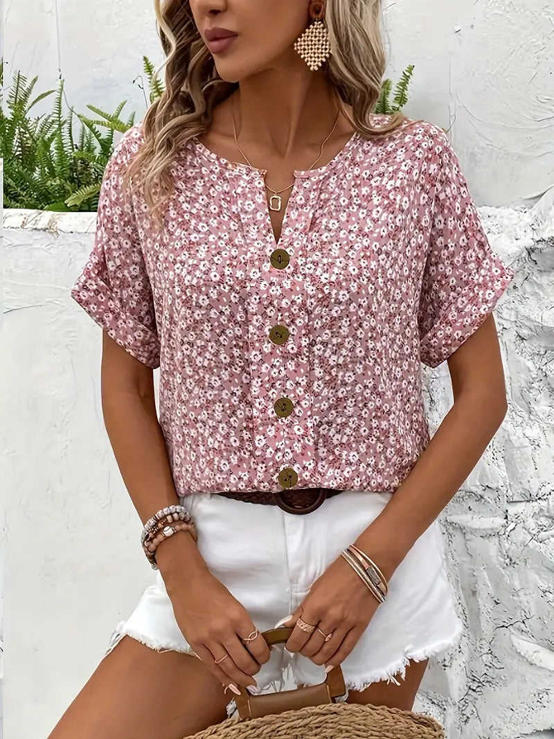 Close-up of button front detail on women's floral pattern casual blouse