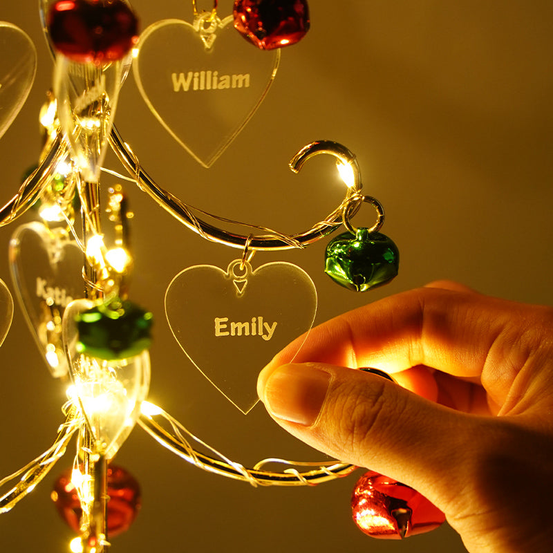 Wooden custom name Christmas tree tabletop decoration displayed on a festive holiday mantel
