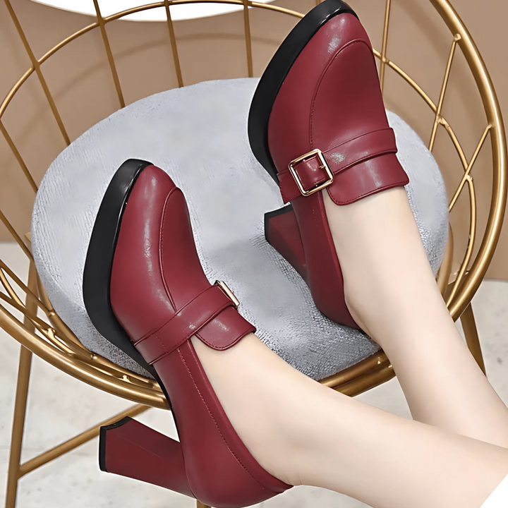 Close-up view of comfortable red pumps featuring ergonomic design and steady heel