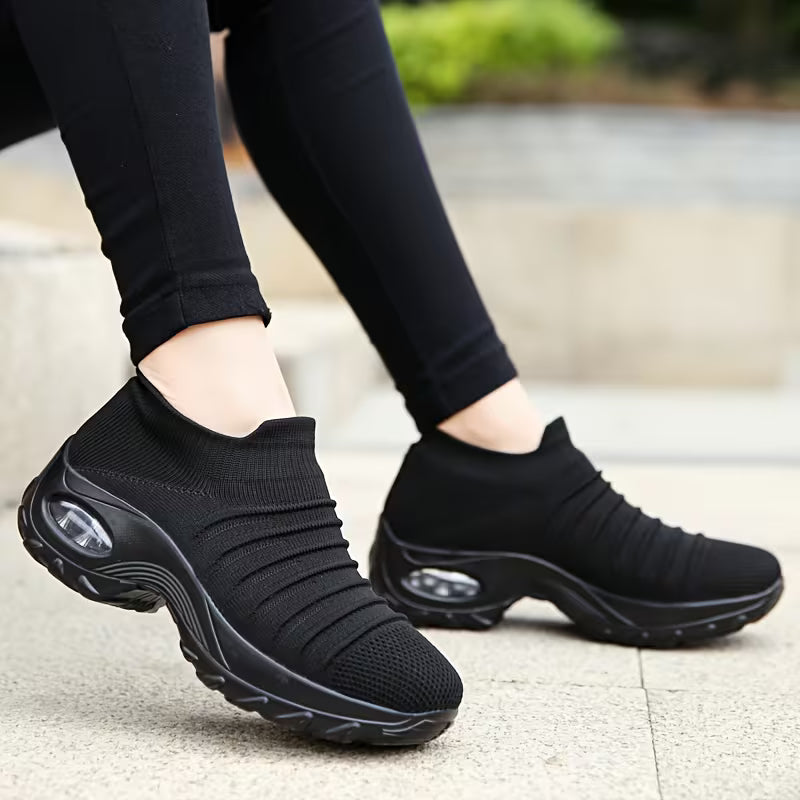 Close-up of women wearing black orthopaedic comfort shoes outdoors