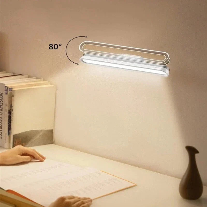 Magnetic LED touch desk lamp plugged into a USB cable for fast battery charging