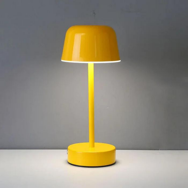 Modern bedside lamp illuminating a nightstand with soft energy-efficient light