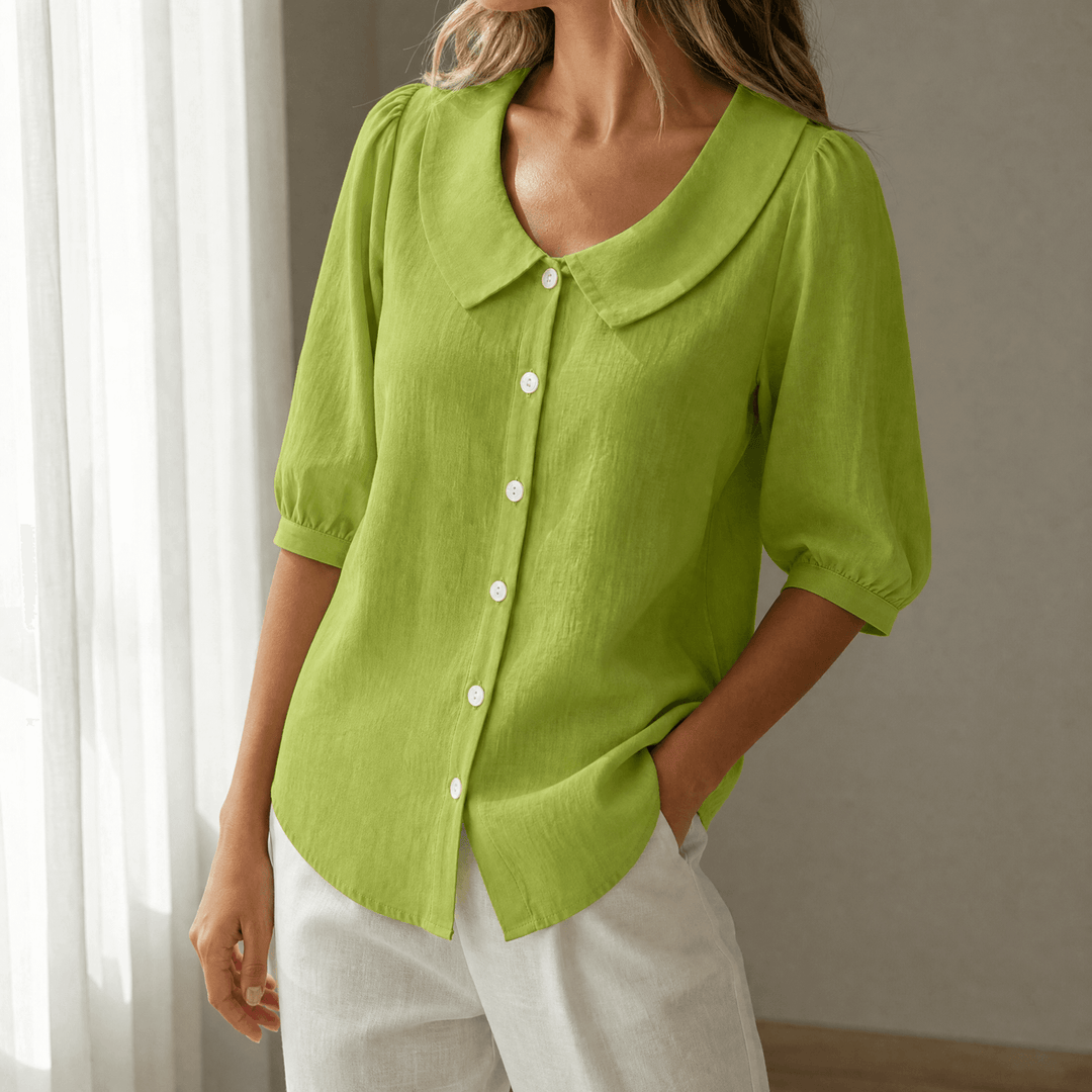 Lifestyle shot of woman wearing vintage style button-up blouse
