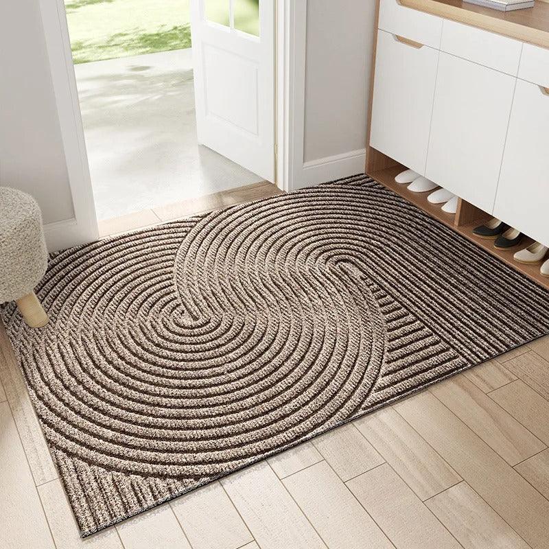 Khaki geometric pattern sand-trapping doormat at front door