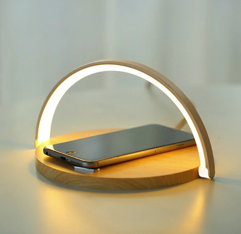 Compact bedside night lamp with warm LED glow and phone resting horizontally