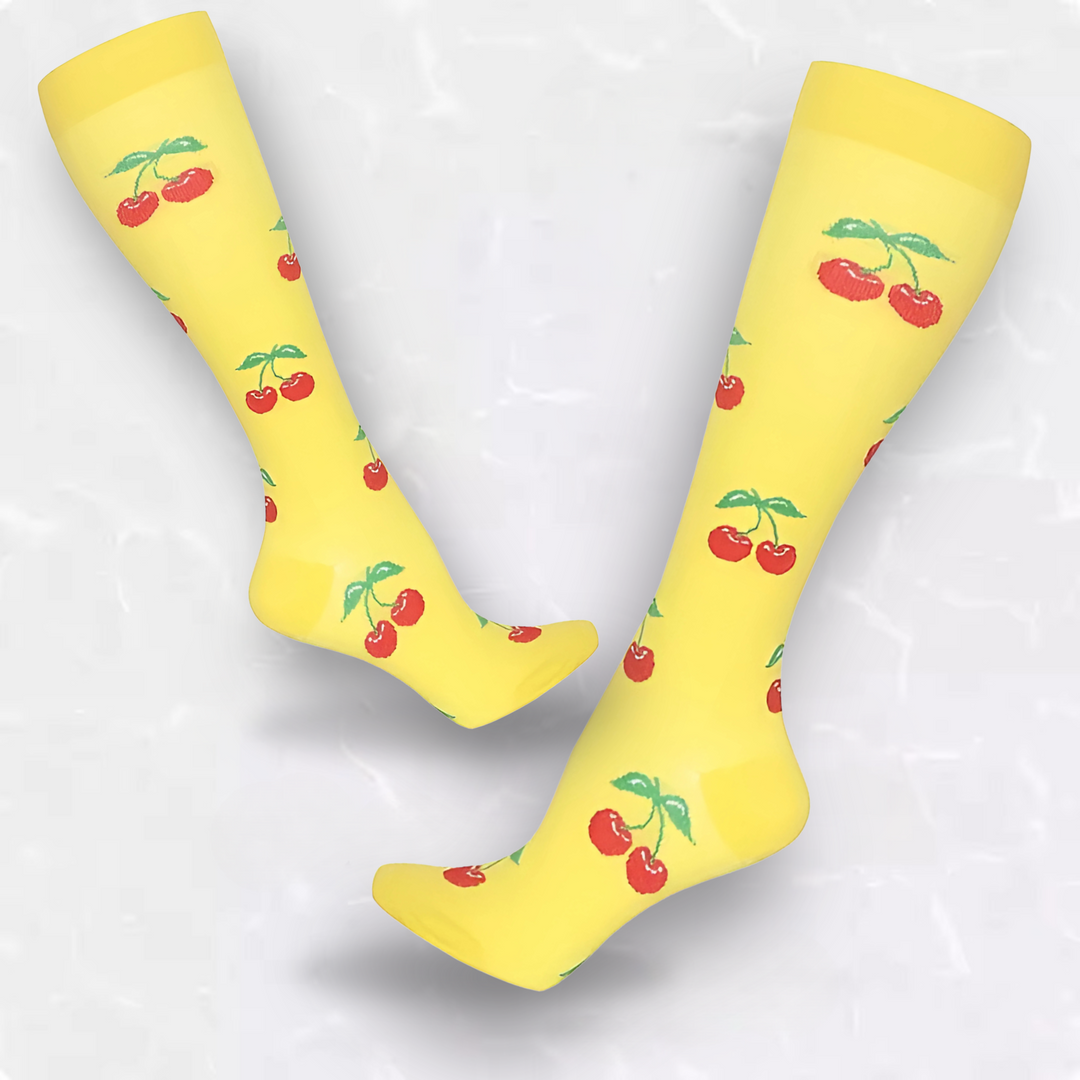 Pair of cute fruit support socks displayed on wooden background