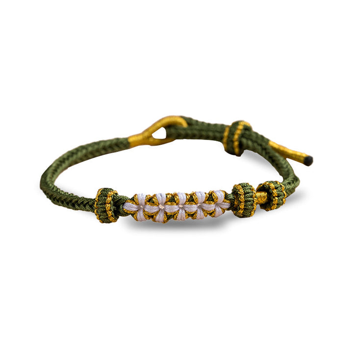 Top view of sentimental knot bracelet with gift packaging