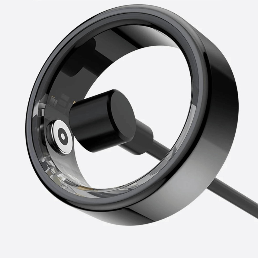 Lifestyle shot of the wearable tech smart ring on a wooden table