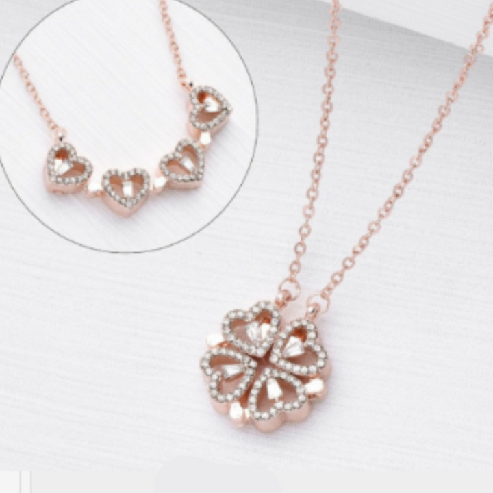 Silver womens necklace with brilliant diamond pendant resting on a silk surface
