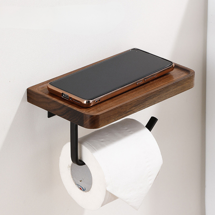 Walnut toilet paper holder with black metal frame holding a phone and toilet roll