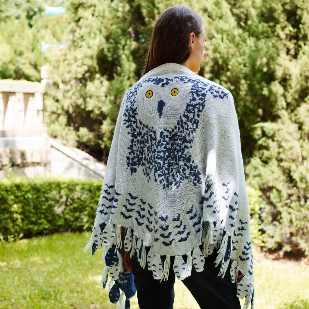 Fringed hem detail on the cozy women's owl shawl wrap accessory.