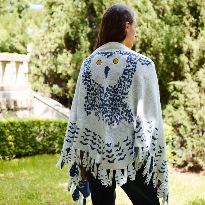 Fringed hem detail on the cozy women's owl shawl wrap accessory.