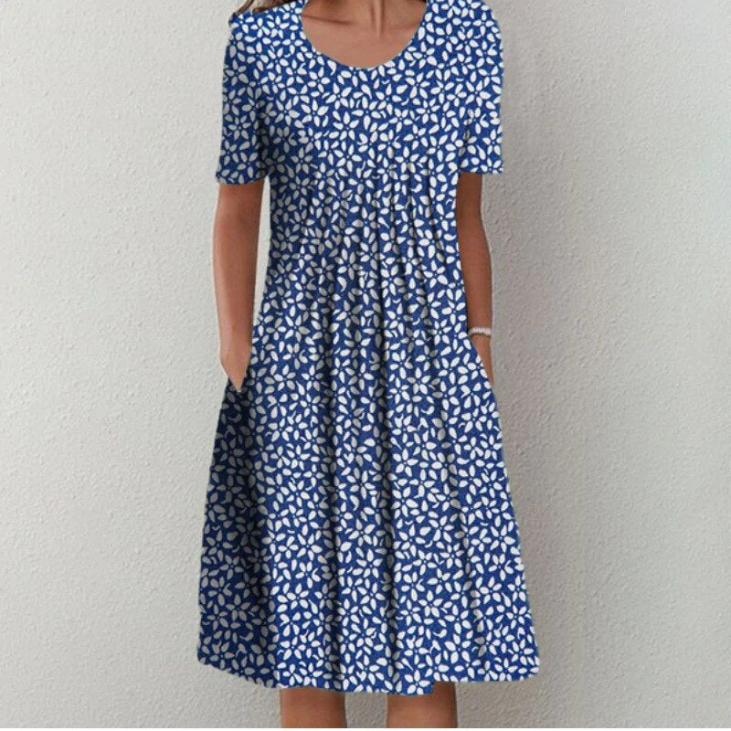 Lightweight womens summer dress with a playful floral pattern and midi length.