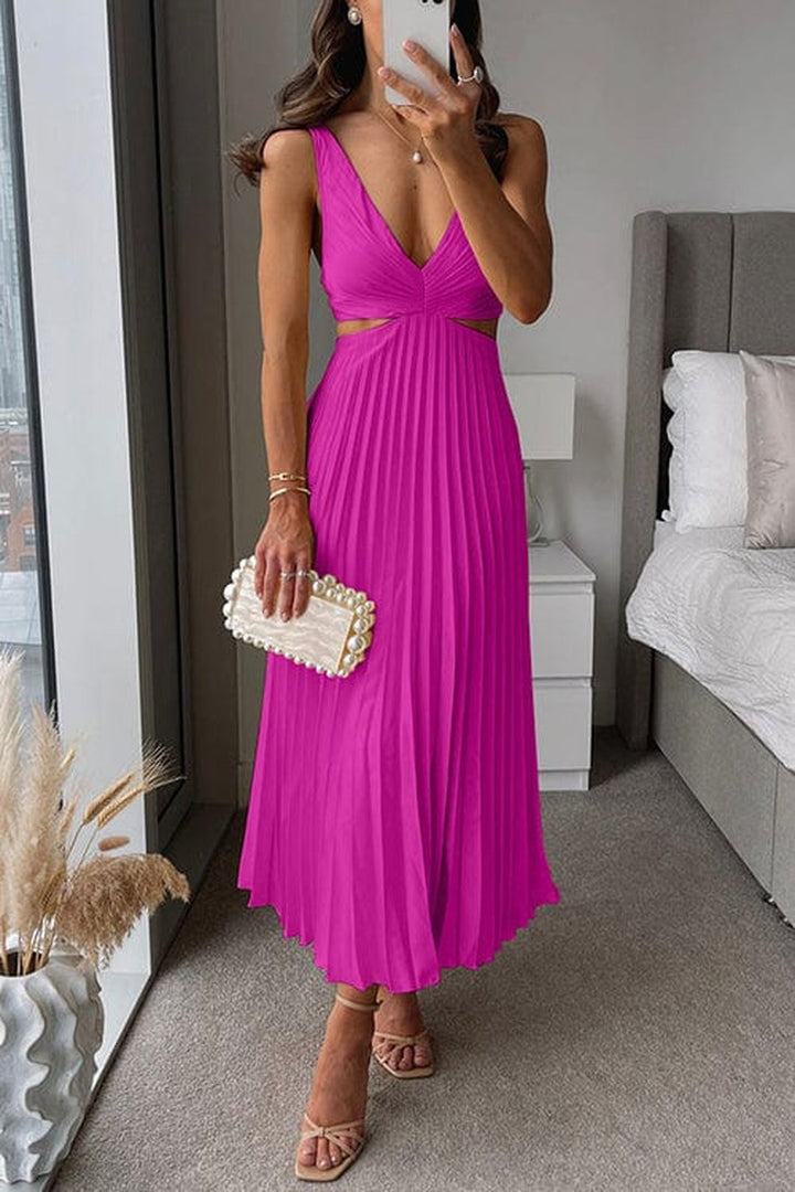 Close-up of the fine pleated fabric texture on the elegant midi dress