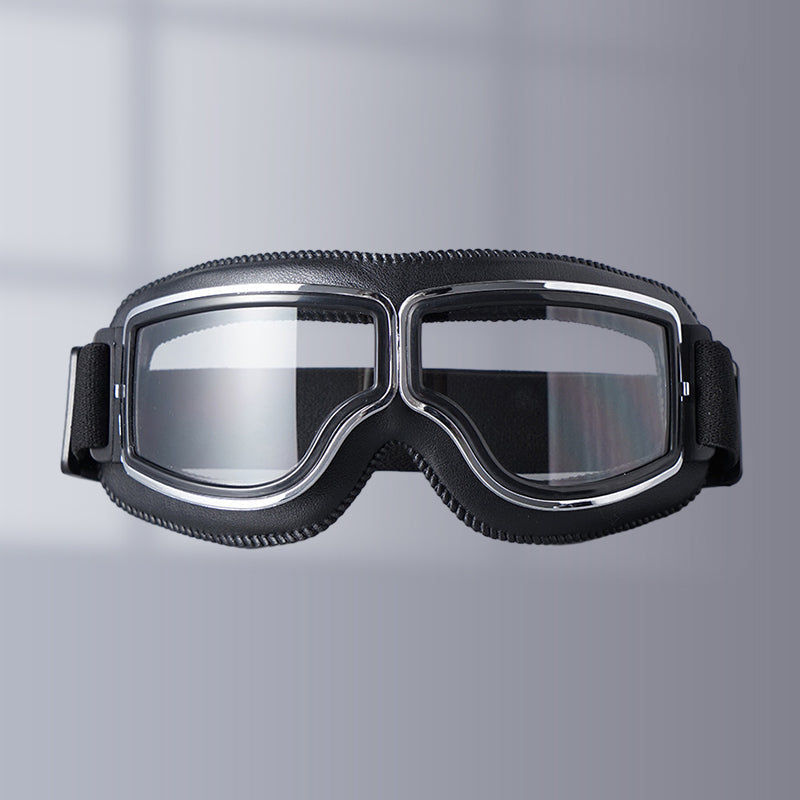 Black vintage motorcycle goggles with clear lenses