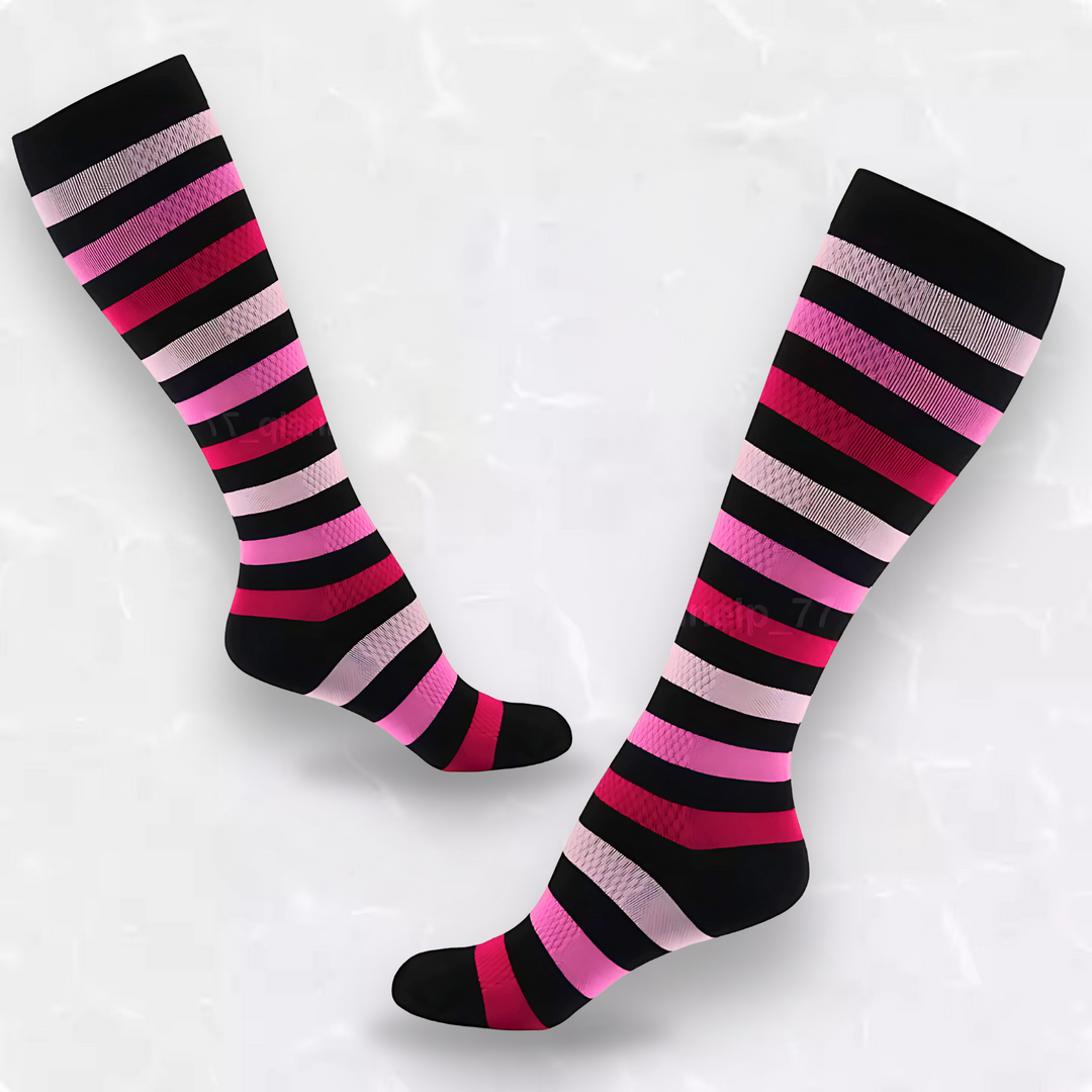 Pair of pink and black striped compression socks on a neutral background