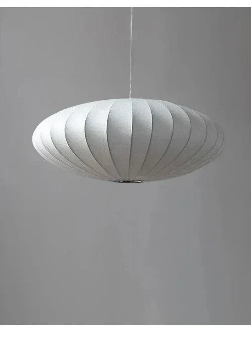 Interior lighting setup featuring the elegant silk pendant lamp in a room