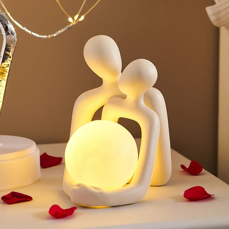 Ceramic couple mood light casting warm ambient lighting in a modern living room