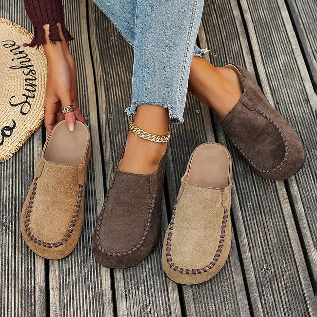 Side view of comfortable womens flat sandals and walking shoes