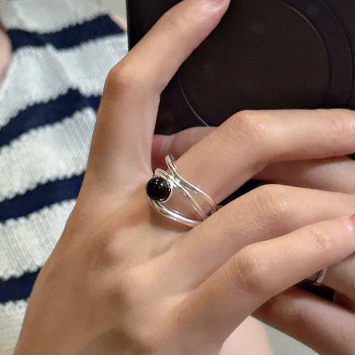 Womens multi-line gemstone statement ring in silver, side profile view showing band detail