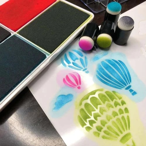 Kids art set featuring various stamps and colorful ink pads
