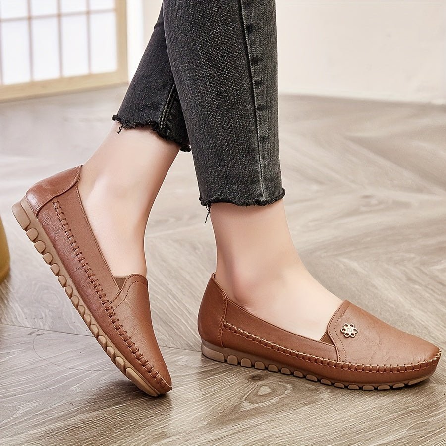 Top angle view of pink casual flats emphasizing the rounded toe box and slip-on convenience.