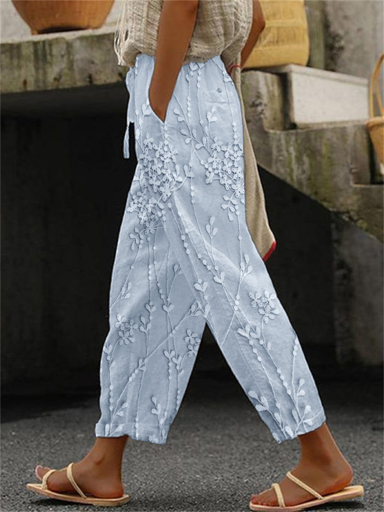 Woman wearing blue trendy printed trousers with relaxed fit
