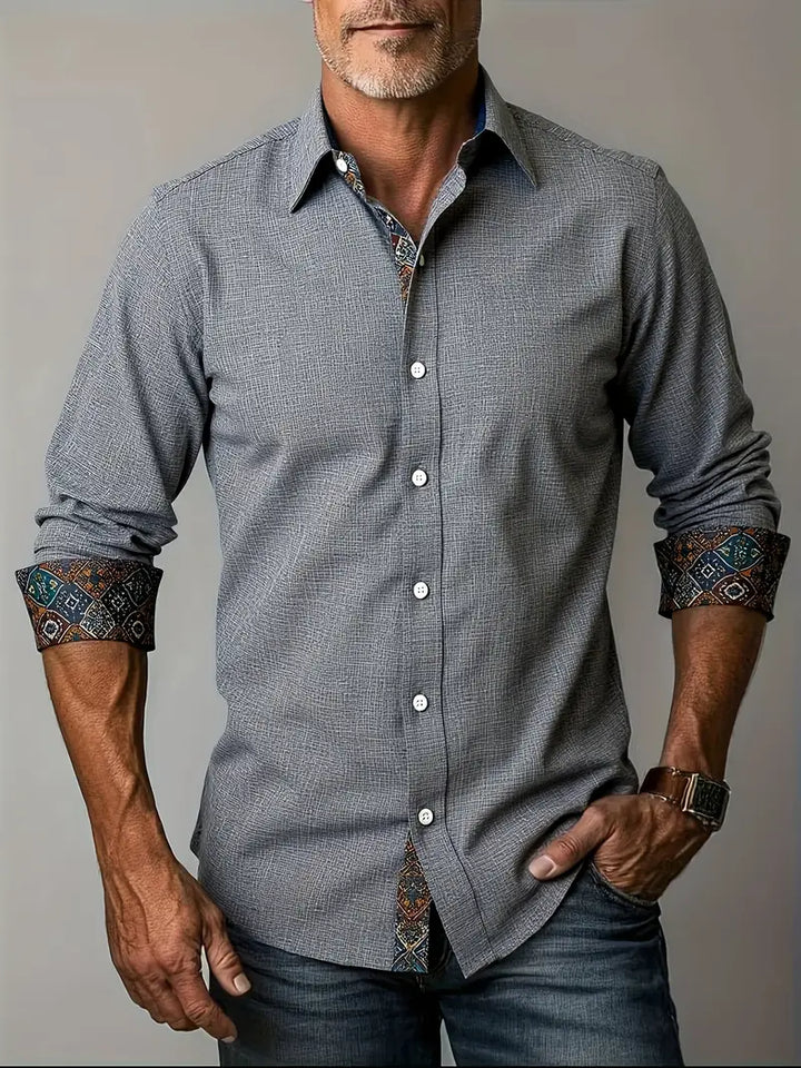 Premium fabric texture closeup of mens casual button-up shirt in white