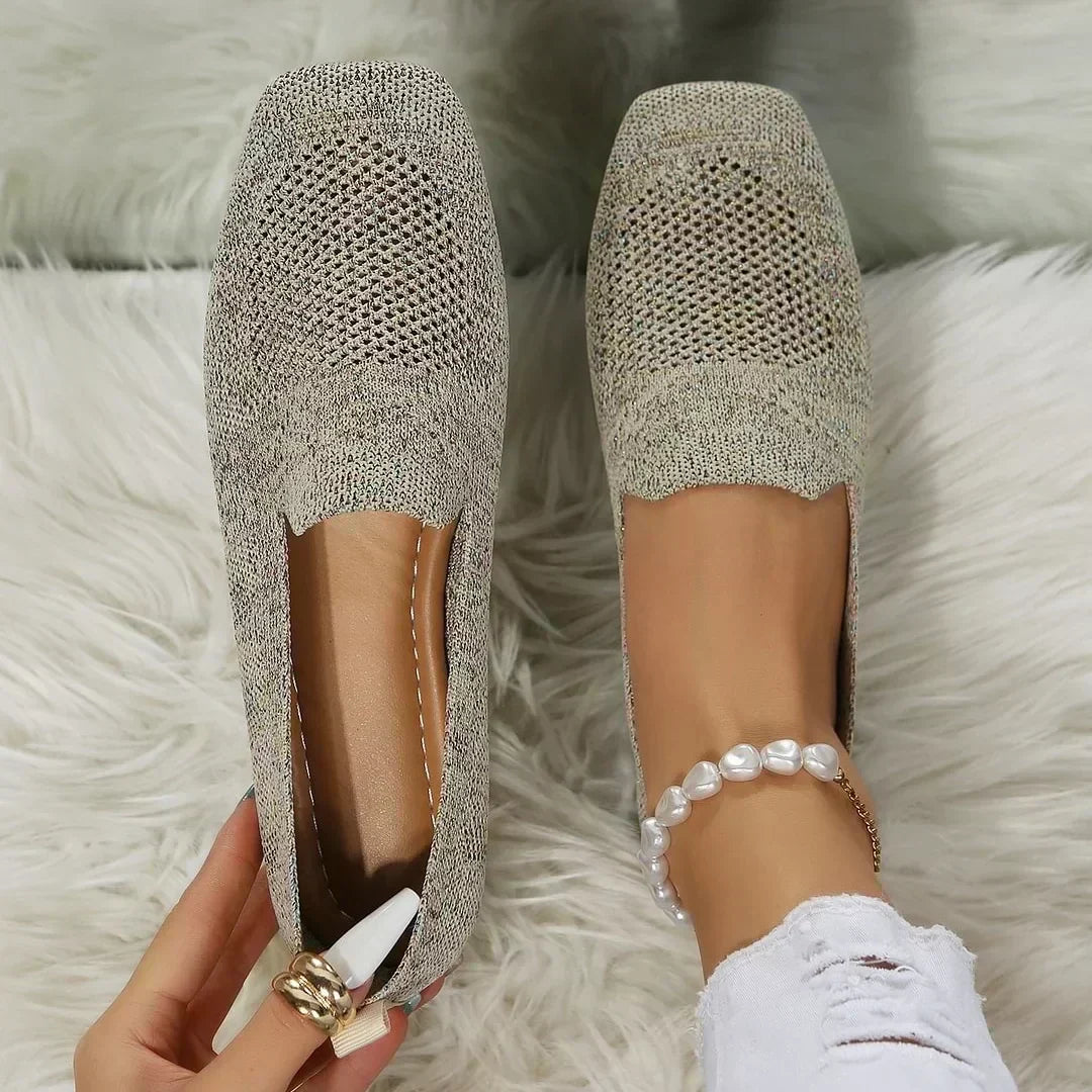 Top-down view of women's slip-on comfort walking shoes on white fur